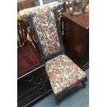 A Victorian prie dieu prayer chair, with carved supports, upholstered, on scrolling cabriole legs