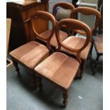 A set of four balloon back dining chairs with stuffover seats