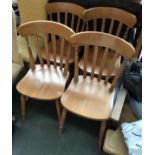 A set of four beechwood lathe back kitchen chairs