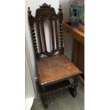 A Charles II style oak side chair, foliate carved top, on barley twist supports, block turned legs