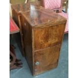 A pair of bedside cabinets, each with drop front cupboard above cupboard door, each 65.5cmH