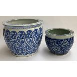 Two Oriental blue and white ceramic planters, the smaller with four character marks to base, 36cmD