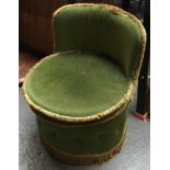 A small green circular bedroom chair