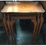 A nest of three small burr walnut tables on cabriole legs, the largest 50.5cmW
