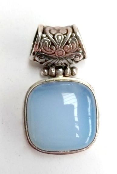 An agate and silver pendant