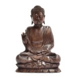 A Chinese hardwood carving of a seated Buddha, 33cm high