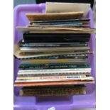 A mixed box of music books and sheet music