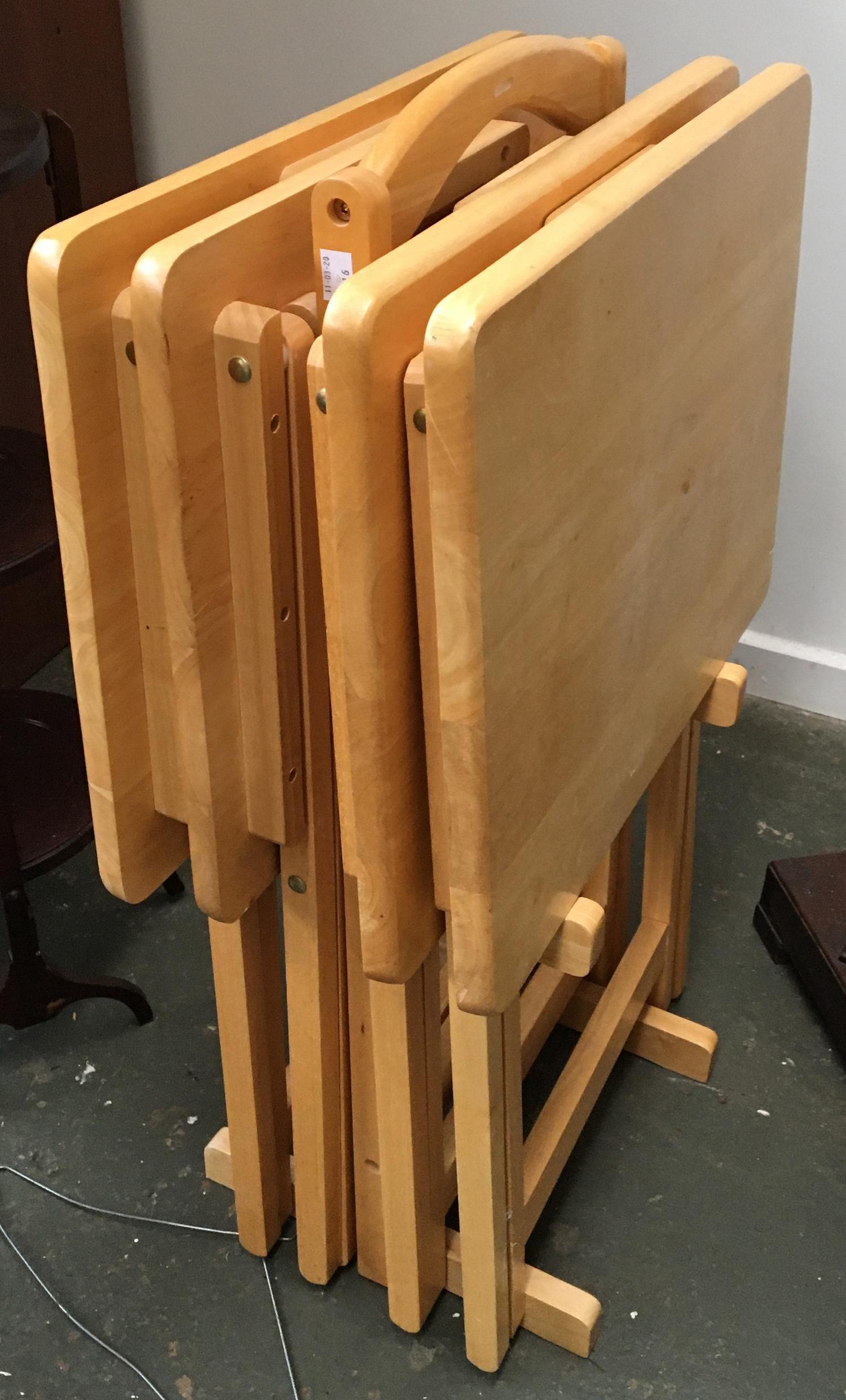 A rack of four folding occasional tables