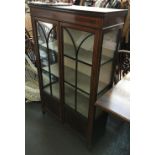 A glazed display cabinet/bookshelf, with light wood stringing, 140cmH