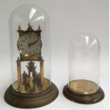 A gilt metal mantel clock in glass cloche, together with one other glass cloche