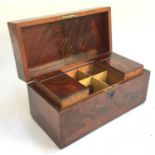 A George III mahogany tea caddy, of rectangular form, with two hinged canisters, 30x14.5x15cmH