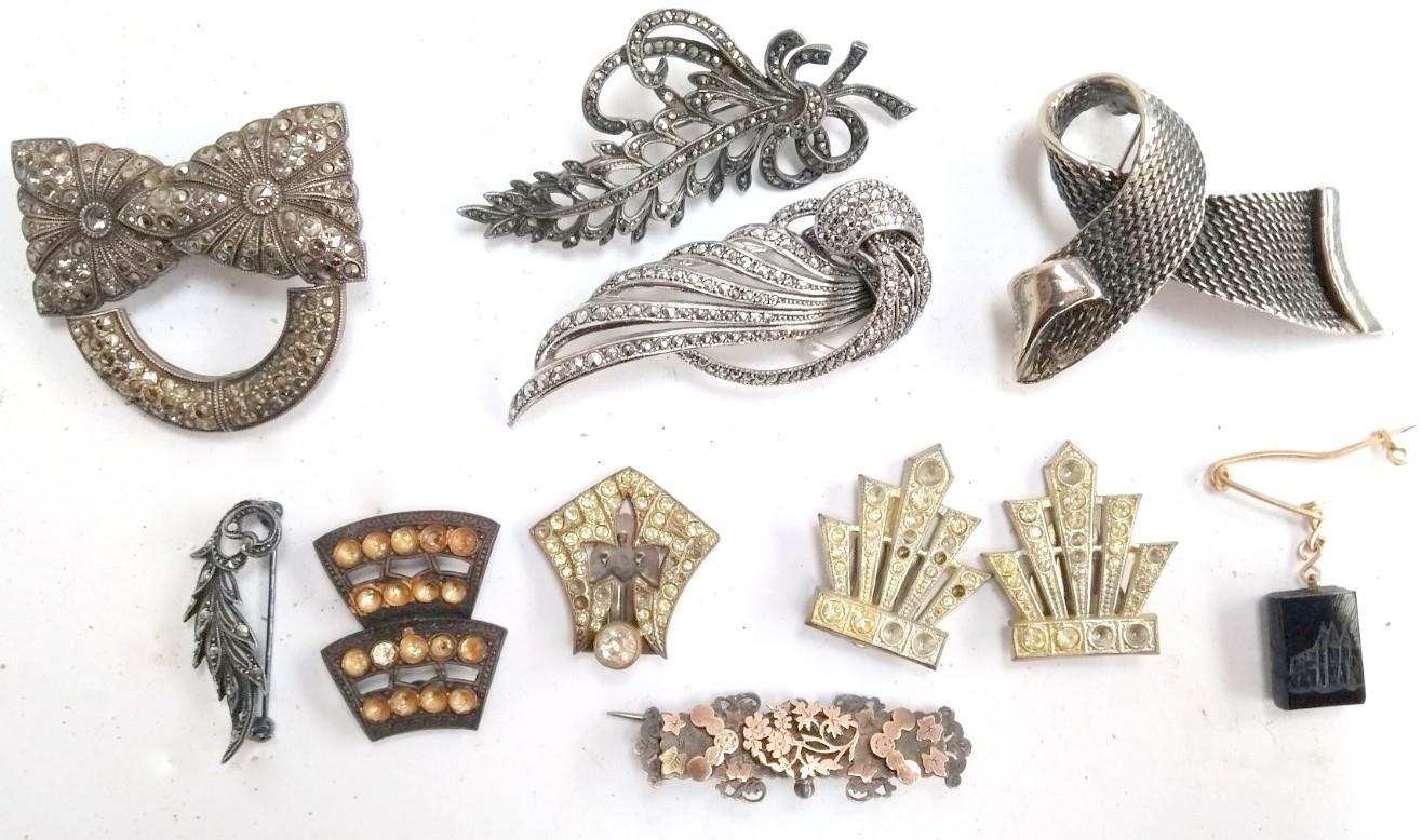 Various brooches and clips including one silver with marcasites, a Victorian silver brooch inlaid