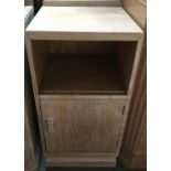 A limed oak bedside cabinet, shelf above cupboard door, 35x68cmH; together with a small oak