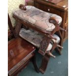 Three folding 'camel' stools with leather cushions