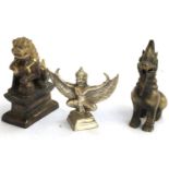 A brass figure of a Chinese foo dog on plinth; a cast metal figure of two monkeys carrying a howdah;