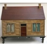A late 19th century dolls house, with lifting roof, glazed windows, loop carry handles