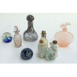 A number of glass scent bottles and several paperweights