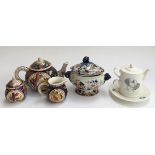 A mosaic style teapot, milk jug and sugar pot ; together with a 'Reflections Fine Bone China' tea