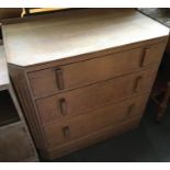 An oak chest of three graduating drawers, with carved canted corners, 79cmW