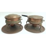A pair of copper chafing dishes on stands, with burners and trays below