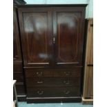 A late 19th century mahogany linen press with satinwood banding, cupboard with three slides above