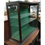 A green baize lined glass display cabinet with two shelves, 91.5x31x79cmH