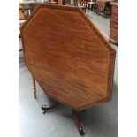 A 19th century tip-tip octagonal dining table with marquetry tip, on cabriole tripod base and