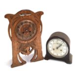 An oak cased Art Nouveau mantle clock, with key, 42cmH; together with a Smiths Enfield mantle clock