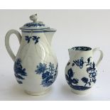 A porcelain cream jug with blue and white fence pattern, 15cmH, (af); together with a smaller blue