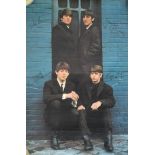 A photographic print of a signed poster of the Beatles, 76x51cm