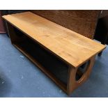 A long low mid-century contemporary maple coffee table, 120x40.5x41cmH
