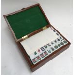 A mahjong set in small wooden box