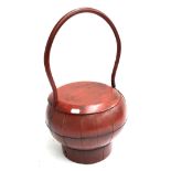 A Chinese red lacquered basket with lid, 50cmH
