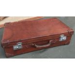 A vintage leather suitcase, monogrammed H.P.M, 72cmW