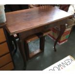 A mahogany side table, three quarter moulded top above frieze drawer, on faceted cabriole legs,
