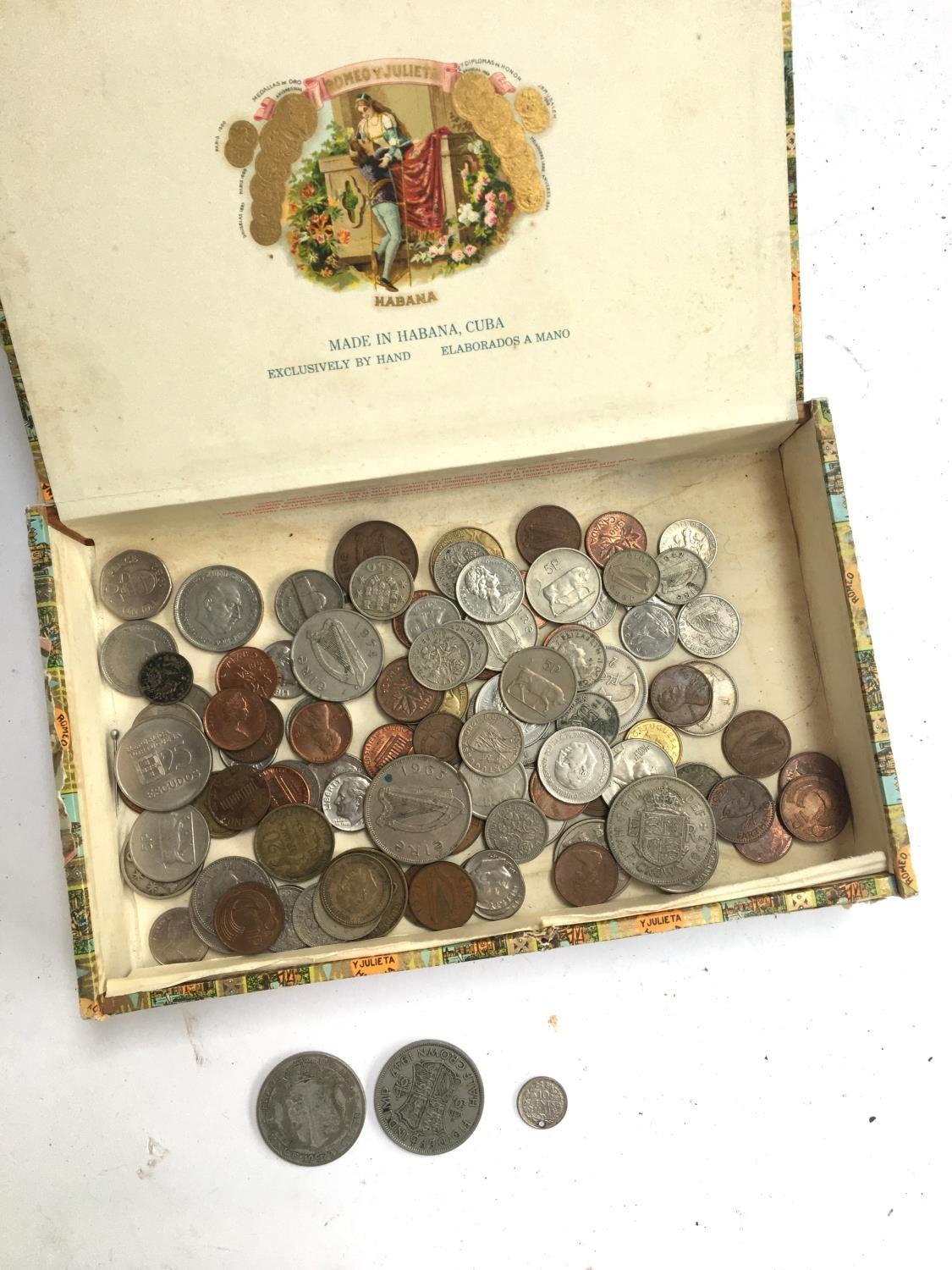 Three silver coins, a 1923 half crown; a 1947 half crown and a Dutch 194110 cent coin; together with