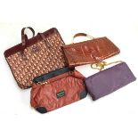 A collection of four handbags to include two marked 'CD', one snakeskin and one other (4)