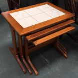A nest of three tile top tables, a 19th century X frame stool with reeded supports, and a small