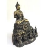 A cast metal figure of a Buddha with five seated worshippers, 29cmH