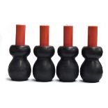 Four large ebonised baluster candlesticks, each 30cm high