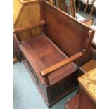 A 20th century oak settle table with hinged seat and linenfold carving, 84cmW