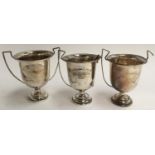 Three silver trophy cups from the Harewood Downs Golf Club, two AF, each 10cm high, 5oz