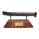 A large copper rivet mounted on oak stand, bearing plaque 'From H.M.S. Anson 44 canon payship to