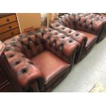 A pair of oxblood button back Chesterfield style armchairs, each approximately 108cmW