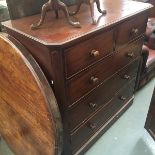 A large Victorian mahogany chest of two short over three long drawers, the drawers flanked by canted
