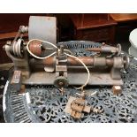 A small vintage tabletop lathe
