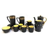 A Maling black and gilt coffee set with yellow lustre interior, the sugar bowl as found; together wi