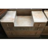 A limed oak dressing table with four drawers, 102cmW