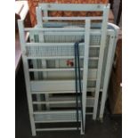 A vintage child's cot with drop sides and sprung base