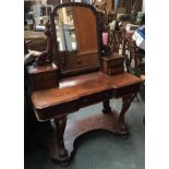 A Victorian mahogany duchess dressing table, adjustable mirror on carved brackets raised on two